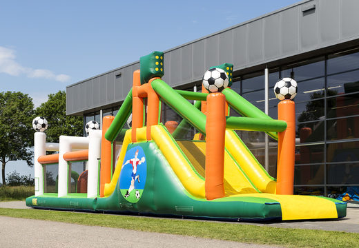 Buy a 17 meter wide inflatable obstacle course in the theme of football with 7 game elements and colorful objects for kids. Order inflatable obstacle courses now online at JB Inflatables UK