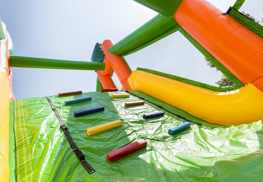 Buy a football themed inflatable obstacle course with 7 game elements and colorful objects for children. Order inflatable obstacle courses now online at JB Inflatables UK