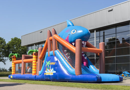 Buy a 17-metre-wide shark-themed obstacle course with 7 game elements and colorful objects for kids. Order inflatable obstacle courses now online at JB Inflatables UK