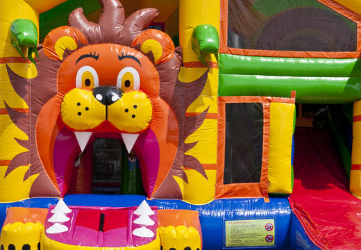 Bouncy castle in lion theme with slide, pillars on the jumping surface and striking 3D objects for children. Buy inflatable bouncy castles online at JB Inflatables UK