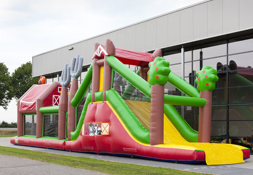 Order an inflatable farm-themed obstacle course with 7 game elements and colorful objects for kids. Buy inflatable obstacle courses online now at JB Inflatables UK