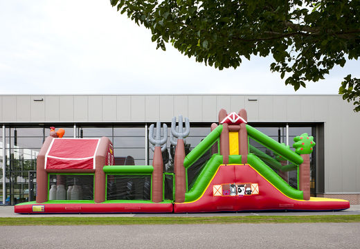 Order a unique 17 meter wide inflatable obstacle course in a farm theme for children. Order inflatable obstacle courses now online at JB Inflatables UK