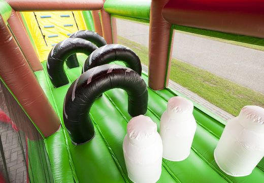 Farm themed inflatable unique 17 meter wide obstacle course with 7 game elements and colorful objects to buy for children. Order inflatable obstacle courses now online at JB Inflatables UK