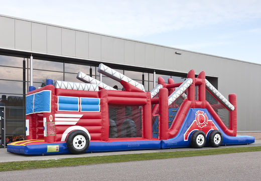 Buy a 17 meter wide inflatable obstacle course in the theme of a fire department with 7 game elements and colorful objects for kids. Order inflatable obstacle courses now online at JB Inflatables UK