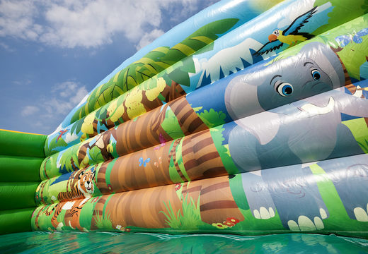 Buy a jungleworld themed inflatable slide with fun 3D figures and colorful prints for kids. Order inflatable slides now online at JB Inflatables UK