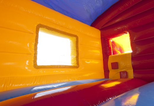 Buy an inflatable indoor maxi multifun bouncy castle in a clown theme with slide for kids. Order bouncy castles online at JB Inflatables UK