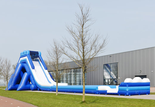 Monsterslide 11 meters high and 53 meters long with a double staircase and wide slide. Order inflatable slides now online at JB Inflatables UK