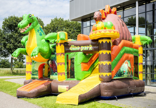 Buy medium covered inflatable multiplay bouncy castle  in the theme dinoworld with slide for children. Order inflatable bouncy castles online at JB Inflatables UK