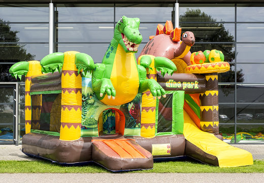 Order a multiplay bouncy castle  in the dinoworld theme with slide for children. Buy inflatable bouncy castles online at JB Inflatables UK