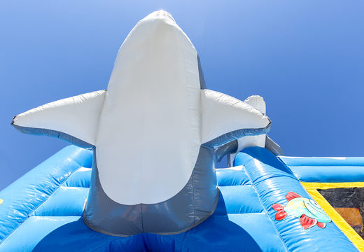 Medium inflatable dolphin themed bouncy castle with slide for kids. Order inflatable bouncy castles online at JB Inflatables UK