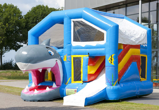 Shark themed bouncy castle with slide, pillars on the jumping surface and striking 3D object for children. Buy inflatable bouncy castles online at JB Inflatables UK