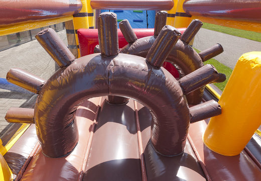 Order an inflatable pirate themed obstacle course with 7 game elements and colorful objects for kids. Buy inflatable obstacle courses online now at JB Inflatables UK