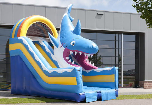 Shark themed multifunctional inflatable slide with a splash pool, impressive 3D object, fresh colors and the 3D obstacles to buy for kids. Order inflatable slides now online at JB Inflatables UK