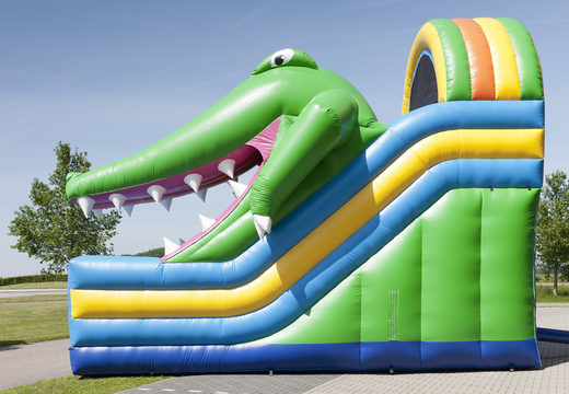 Inflatable slide with a crocodile theme with a splash pool, impressive 3D object, fresh colors and the 3D obstacle for children. Order inflatable slides now online at JB Inflatables UK