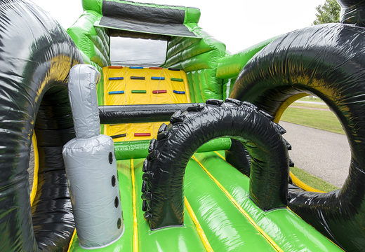 Unique 17 meter wide obstacle course in tractor theme with 7 game elements and colorful objects for kids. Buy inflatable obstacle courses online now at JB Inflatables UK
