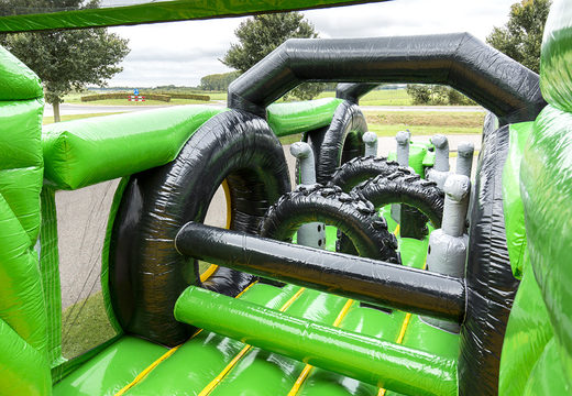 Buy inflatable obstacle course 17 meters wide, tractor themed with 7 game elements and colorful objects for children. Order inflatable obstacle courses now online at JB Inflatables UK