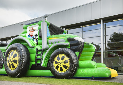 Order a 17 meter wide unique tractor themed obstacle course with 7 game elements and colorful objects for children. Buy inflatable obstacle courses online now at JB Inflatables UK