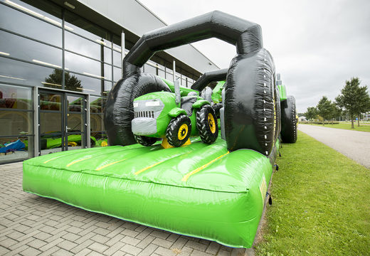 Traktor run 17m obstacle course with 7 game elements and colorful objects for kids. Buy inflatable obstacle courses online now at JB Inflatables UK