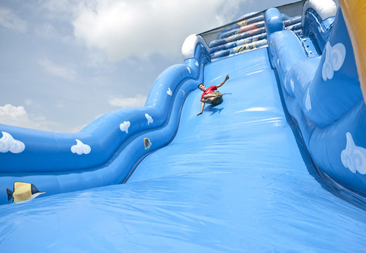 Order an inflatable slide in the Wave theme with a wavy sliding surface and fun underwater world prints for children. Buy inflatable slides now online at JB Inflatables UK