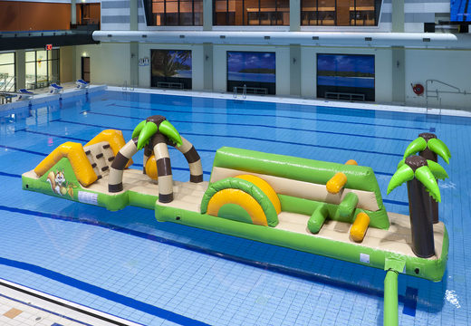 Inflatable double jungle run obstacle course with fun objects and round slide for both young and old. Order inflatable pool games now online at JB Inflatables UK