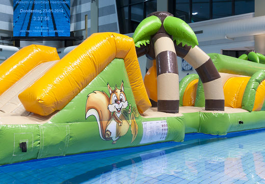 Slide double jungle run assault course with challenging obstacle objects for both young and old. Buy inflatable water attractions online now at JB Inflatables UK