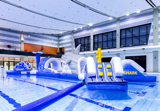 Inflatable double obstacle course 16 meter long hairrun swimming pool obstacle course in a unique design with funny 3D objects and no less than 2 slides for both young and old. Order inflatable pool obstacle courses now online at JB Inflatables UK