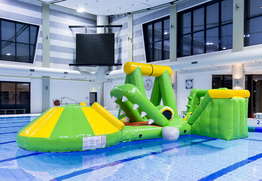 Buy an airtight crocodile inflatable play island with a vine, climbing tower, round slide and obstacles for both young and old. Order inflatable water attractions now online at JB Inflatables UK