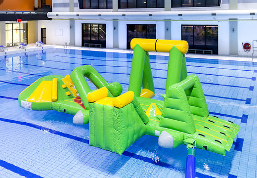 Airtight inflatable crocodile play island with a vine, climbing tower, round slide and obstacles for both young and old. Order inflatable water attractions now online at JB Inflatables UK
