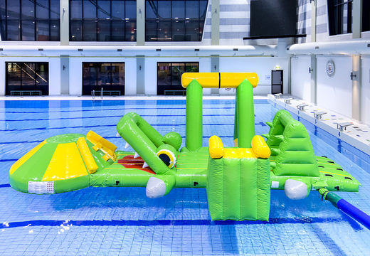 Inflatable airtight crocodile play island with a vine, climbing tower, round slide and obstacles for both young and old. Buy inflatable pool games now online at JB Inflatables UK