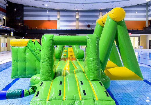 Order an airtight inflatable play island in a crocodile theme with a vine, climbing tower, round slide and obstacles for both young and old. Buy inflatable pool games now online at JB Inflatables UK