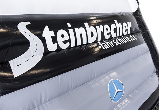 Order your custom made black Steinbrecher fashrschule bus bounce house online now at JB Promotions UK. Buy bespoke inflatable bouncers in different shapes and sizes