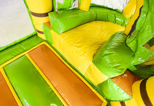 Mini inflatable multiplay bouncer  in jungle theme with slide for children. Order inflatable bouncers online at JB Inflatables UK