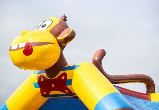 Standard bouncy castle in striking colors and with a large 3D object of a monkey on top, for sale for children. Buy indoor inflatables online at JB Inflatables UK