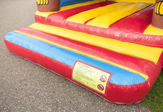 Standard bounce houses in striking colors and with a large 3D object of a monkey on top, for sale for children. Buy bounce houses online at JB Inflatables UK