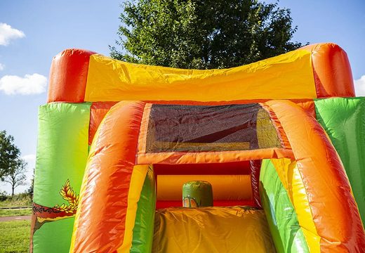 Order a small inflatable multifun bouncy castle for birthday party with slide in dino theme.  Buy bouncy castles at JB Inflatables UK online 