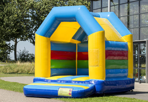 Midi standard bouncy castle in a color combination of yellow blue green and red for kids for sale. Buy bouncy castles online at JB Inflatables UK 