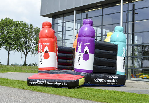 Order bespoke inflatables online Vitamin water open bouncy castle in your own corporate identity at JB Promotions UK; specialist in inflatable promotional items such as custom made bouncy castles