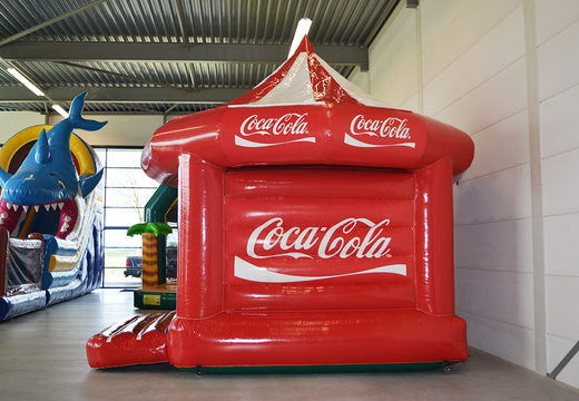 Bespoke Coca-Cola Carousel bouncy castle for various events for sale. Buy custom made inflatable promotional bouncers online from JB Inflatables UK now 