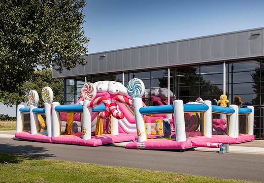 Order colored inflatable park in Candyland theme for children. Buy bouncy castles online at JB Inflatables UK