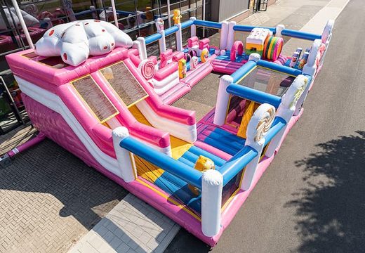 Inflatable Candyworld bouncer with slides and fun obstacles with prints for children. Buy bouncers online at JB Inflatables UK