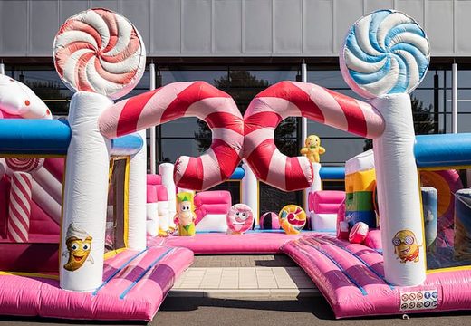 Bounce World Candyland bouncy castle with multiple slides and all kinds of fun obstacles with candyland prints for children. Buy bouncy castles online at JB Inflatables UK