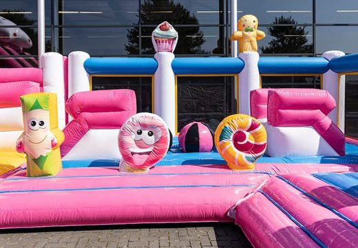 Buy an inflatable Candyworld bouncy castle with multiple slides and all kinds of fun obstacles with candyland prints for kids. Order bouncy castles online at JB Inflatables UK