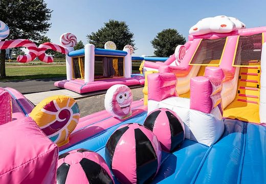 World Candyland bouncy castle with multiple slides and all sorts of obstacles with themed prints for kids. Buy bouncy castles online at JB Inflatables UK