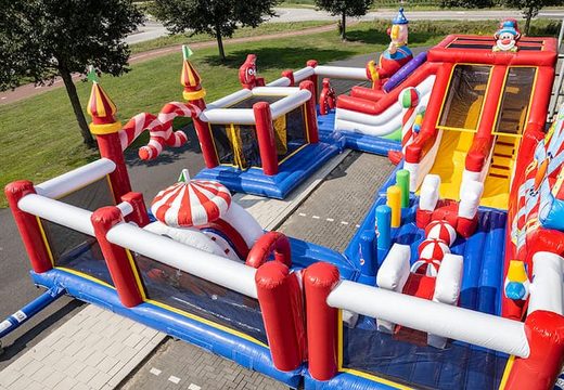 Bounce World circus bouncy castle with multiple slides and all kinds of fun obstacles with circus prints for children. Buy bouncy castles online at JB Inflatables UK