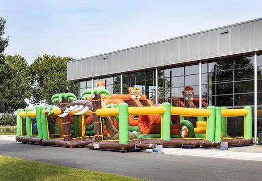 Order colored inflatable park in jungle theme for children. Buy bouncy castles online at JB Inflatables UK