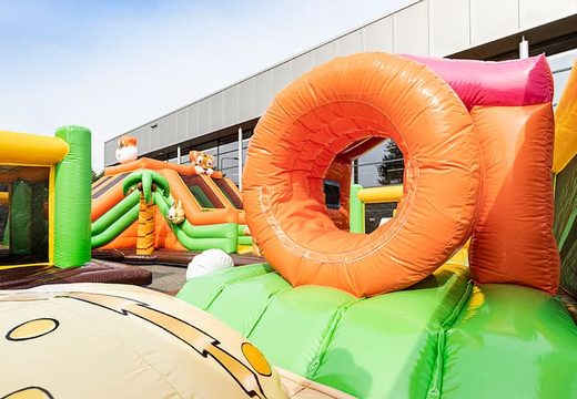 Buy Bounce World jungle bouncy castle with slides and all kinds of obstacles with jungle prints for kids. Order bouncy castles online at JB Inflatables UK