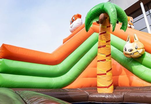 Order an inflatable jungle bouncer with slides and fun obstacles with prints for children. Buy bouncers online at JB Inflatables UK