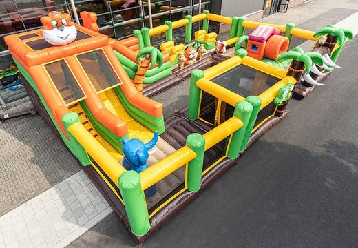 World jungle bouncy castle with multiple slides and all kinds of obstacles with prints that match the theme for kids. Buy bouncy castles online at JB Inflatables UK