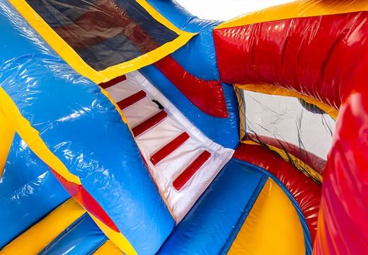 Order a multifunctional bounce house with a roller coaster theme with a slide for kids. Buy bounce houses online at JB Inflatables UK