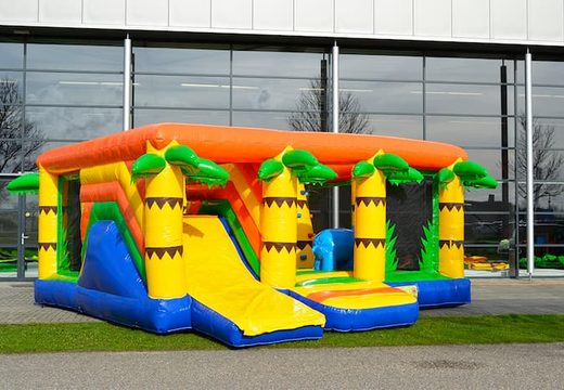 Buy an indoor multiplay jungle bouncy castle in a limited height of 2.74 meters and with a slide for children. Order bouncy castles online at JB Inflatables UK